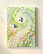 Unframed spring canvas wall art, swirling green brush strokes, mixed colorful wildflowers and two blue butterflies hung on plain light wall